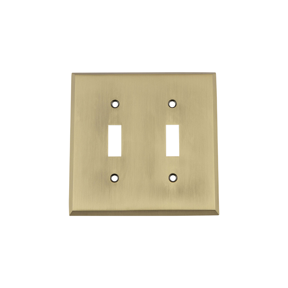 Nostalgic Warehouse NYKSWPLTT2 New York Switch Plate with Double Toggle in Antique Brass