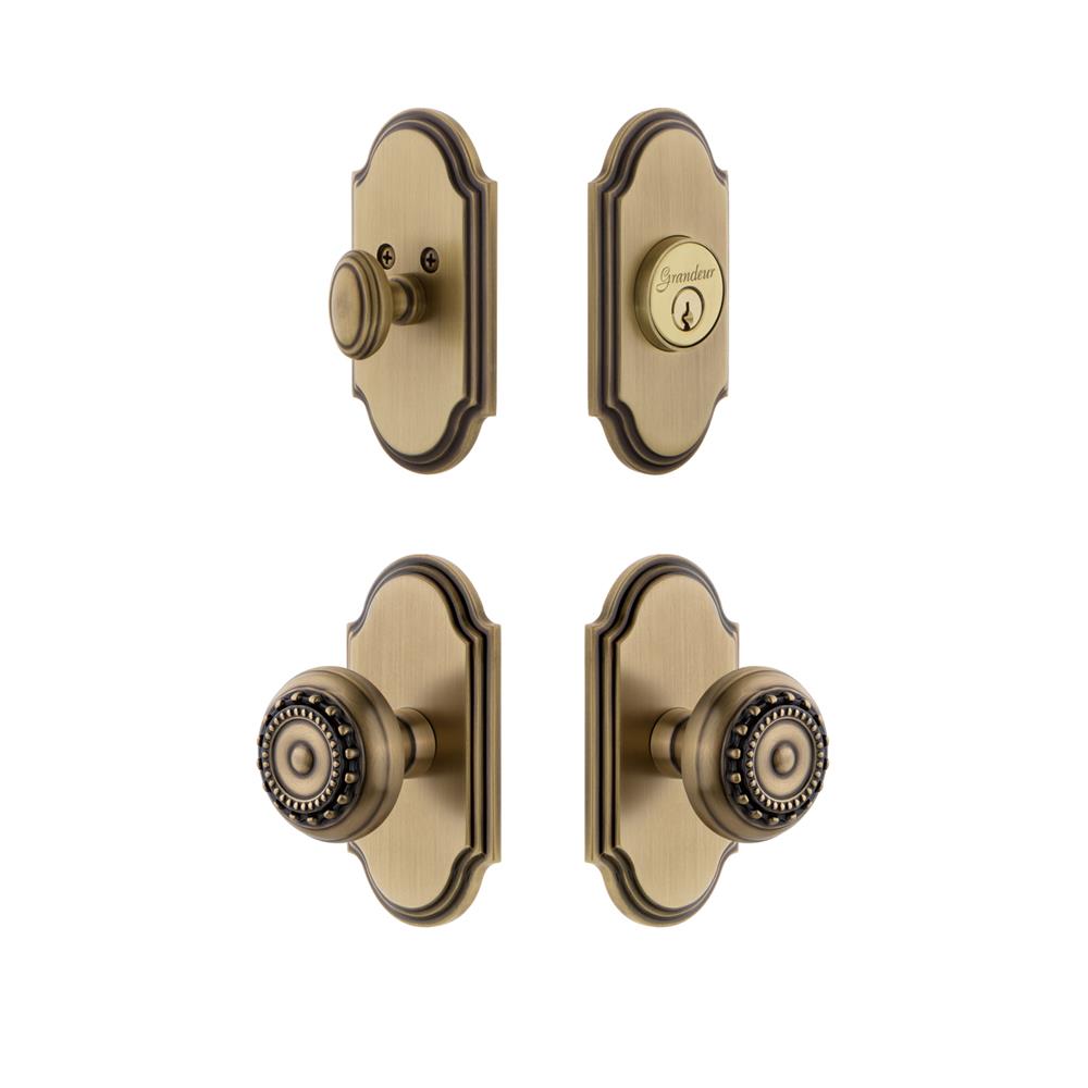 Grandeur by Nostalgic Warehouse ARCPAR Arc Plate with Parthenon Knob and matching Deadbolt in Vintage Brass