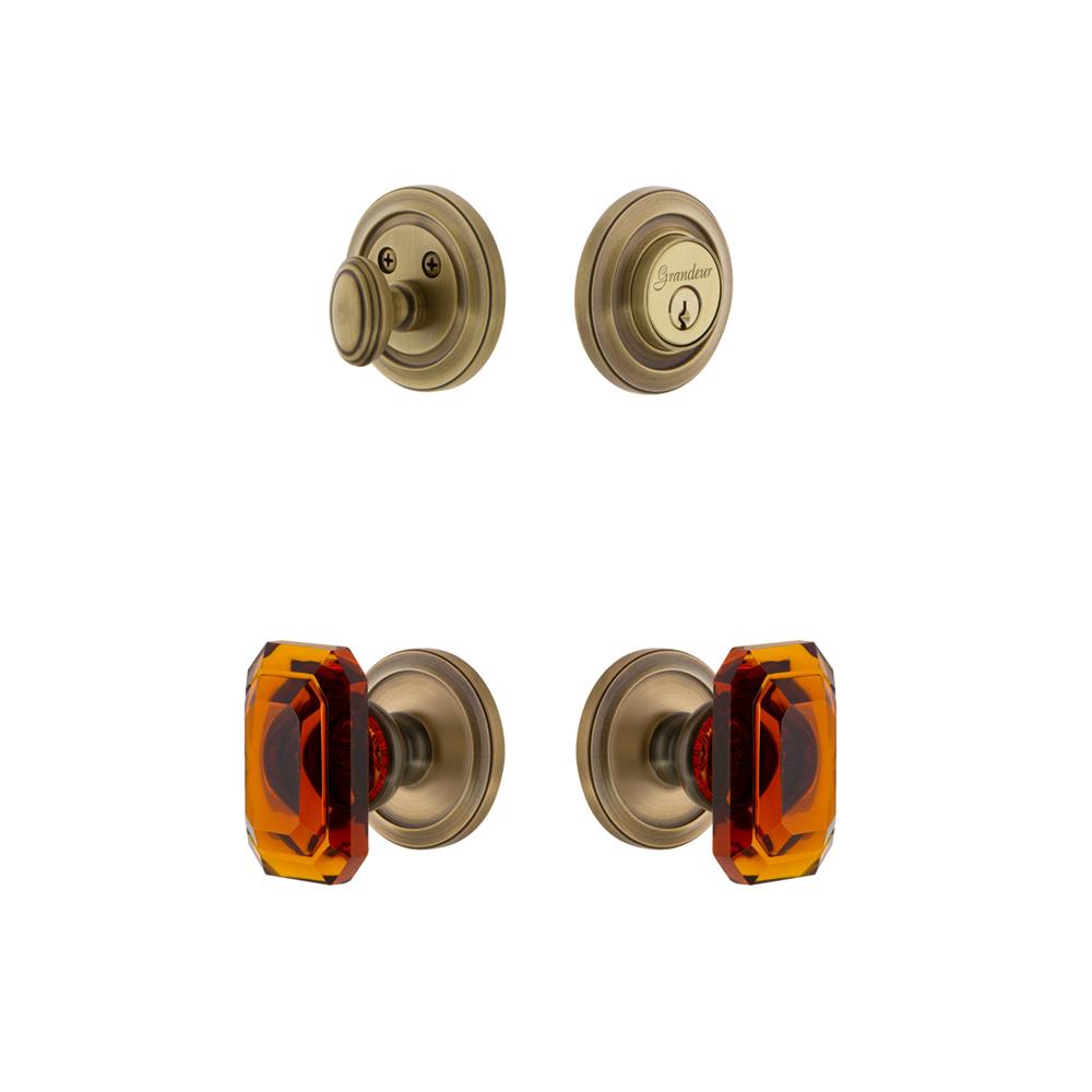 Grandeur by Nostalgic Warehouse CIRBCA Circulaire Rosette with Amber Baguette Crystal Knob and matching Deadbolt in Vintage Brass