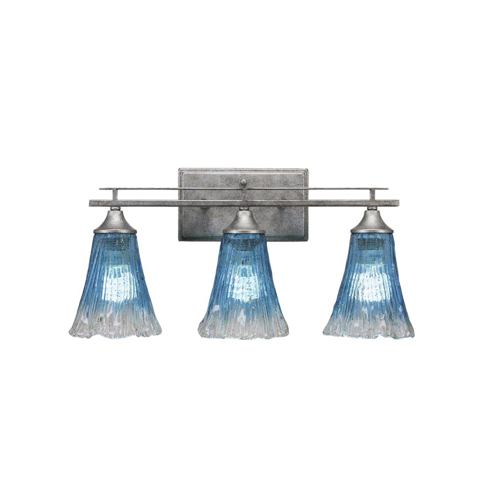 Toltec Lighting 133-AS-725 Uptowne 3 Light Bath Bar Shown In Aged Silver Finish With 5.5" Teal Crystal Glass